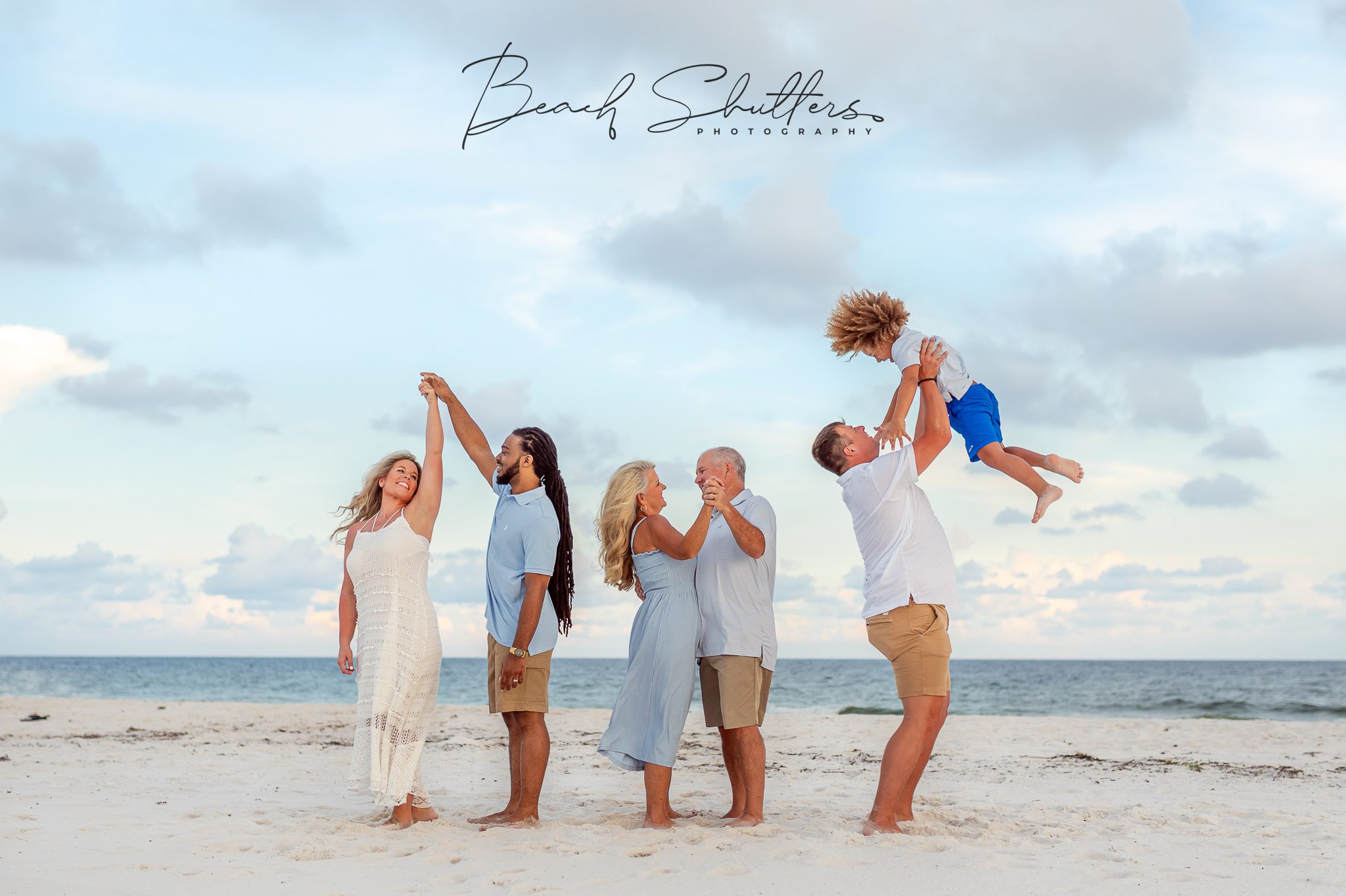 Beach portraits of a gender reveal in Gulf Shores.